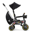 Black Doona Liki Trike with Colorful Sticker Bomb Decals - Side Profile | Strolleria