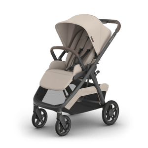 UPPAbaby Kona Stroller in Ada (Sand) with Tan Leather Handle - Hero 3/4 Left View | Strolleria