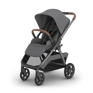 UPPAbaby Kona Stroller in Rowan (Grey) with Tan Leather Handle - Hero 3/4 Left View | Strolleria