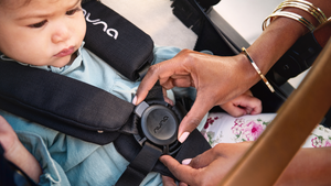 Child being Strapped into A Nuna Demi Grow