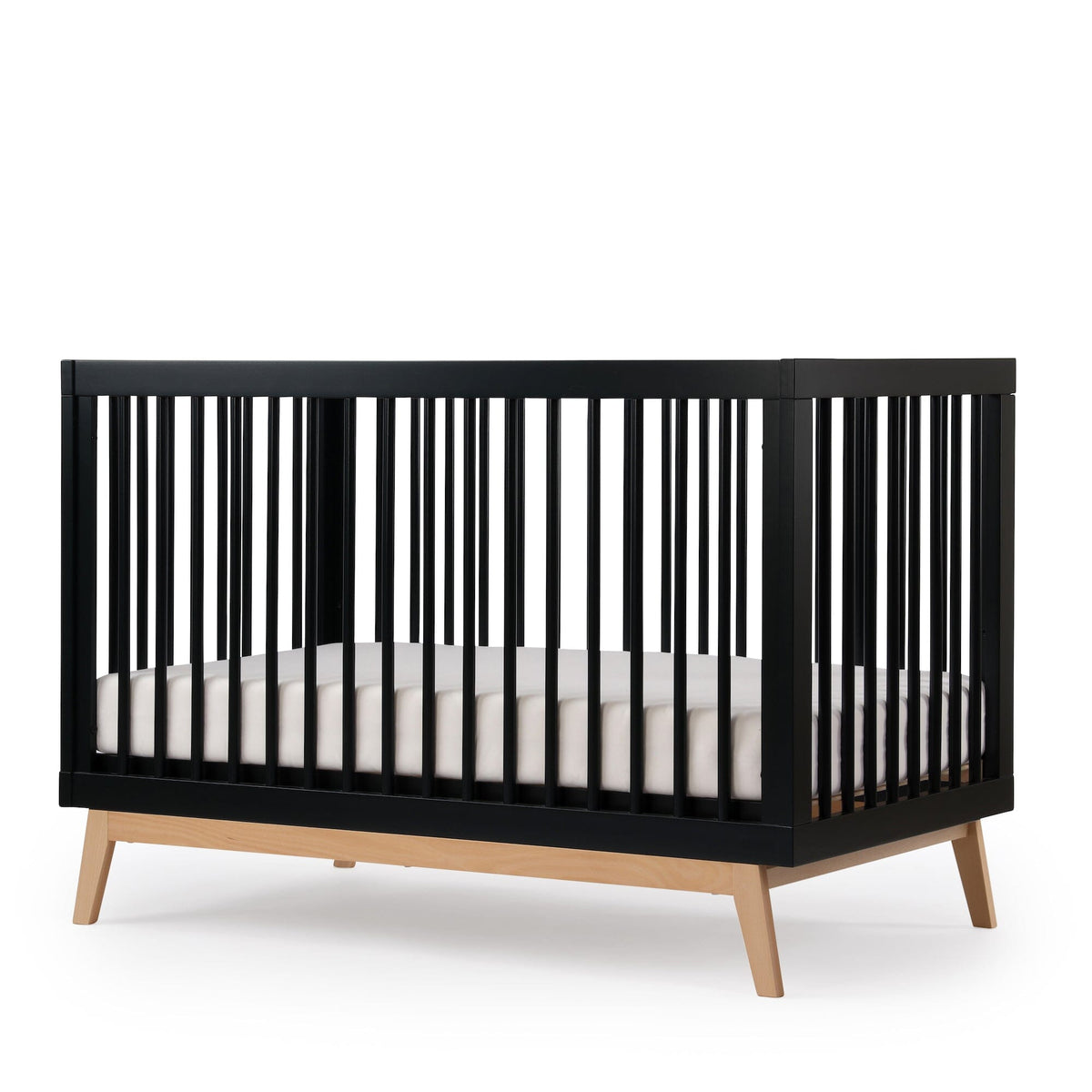 dadada Soho 3-in-1 Convertible Crib in Black with Natural Wood Legs - 45-Degree Angle View | Strolleria