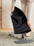 Black Quilted BabyBjörn Extra Fabric Seat Being Removed from Bouncer Bliss - Lifestyle Installation | Strolleria