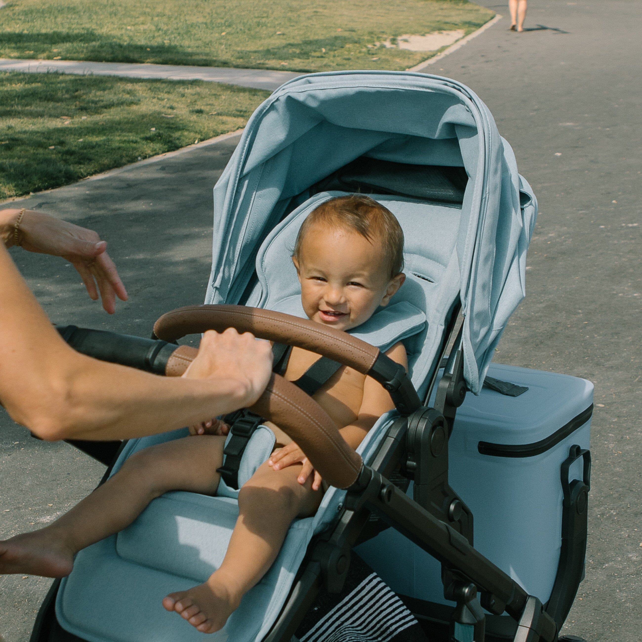 Blue Veer Switchback Stroller with Leather Grip - Baby in Use Outdoors | Strolleria