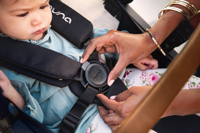 Child being Strapped into A Nuna Demi Grow